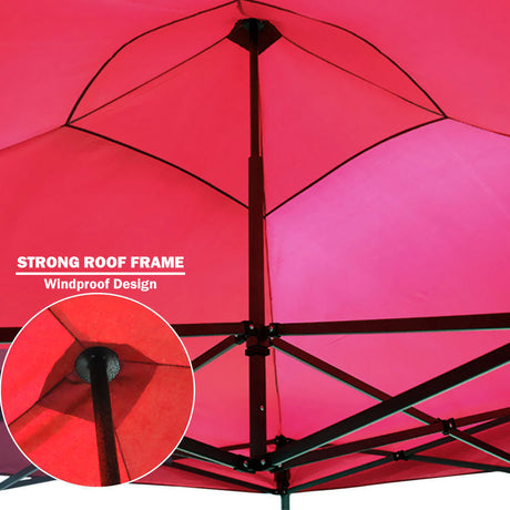 Hook and loop strap securing the red canopy cover to the frame