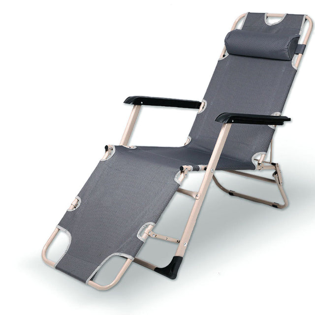 Grey reclining sun lounge chair with padded headrest and adjustable footrest