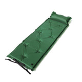 Green self inflating camping mattress with attached pillow and carry bag