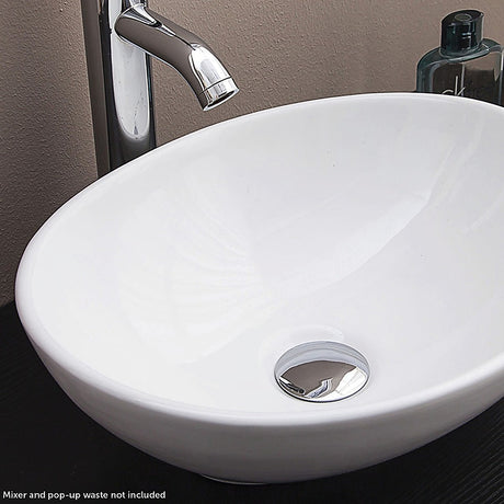 White oval ceramic above counter basin, front view, 40x33cm