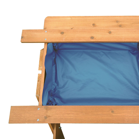 Kids using the sand and water picnic table