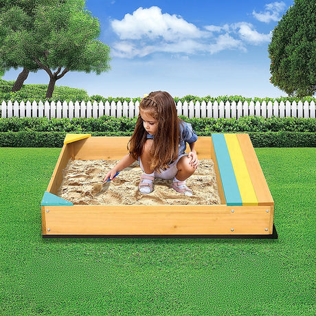 Wooden sandpit with bench seat and storage in blue yellow and brown