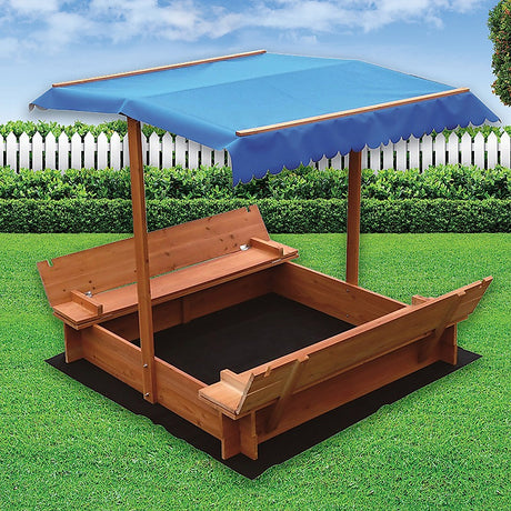 Children playing in wooden sandpit with canopy
