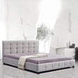 Concord king bed in beige linen with a button tufted headboard in an elegant master bedroom