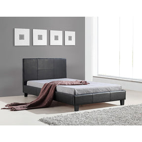 Five Dock king single bed in black PU leather with a padded headboard in a stylish bedroom