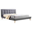 Concord queen bed in grey linen with a button tufted headboard in a refined bedroom