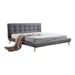 Concord king bed in grey linen with a button tufted headboard in a refined master bedroom