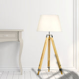 Wood tripod floor lamp with white fabric shade and chrome accents