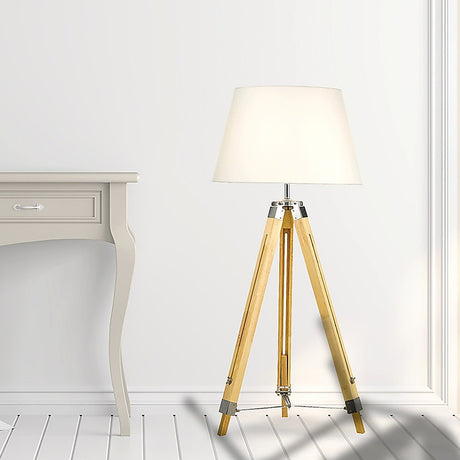 Wood tripod floor lamp with white fabric shade and chrome accents