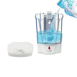 Hand held under the infrared sensor as the dispenser releases a 1 mL dose of soap
