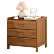 Bangalow dark wood bamboo three drawer bedside table styled in a calm coastal bedroom