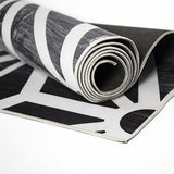Geometric polypropylene floor rug black and white 200x300cm