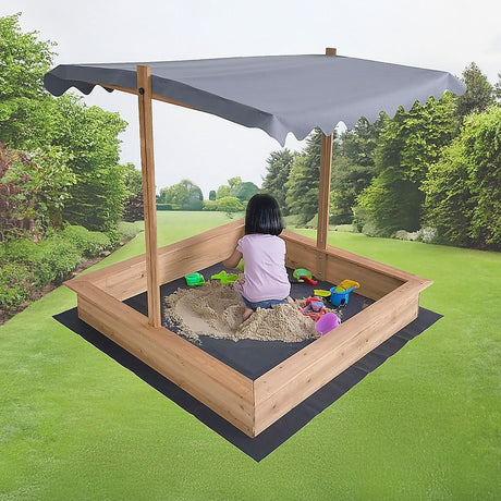 Wooden sandpit with canopy raised