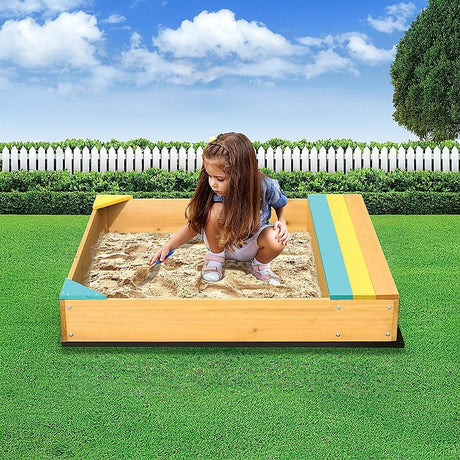 Wooden sandpit with bench seat and storage in blue and yellow
