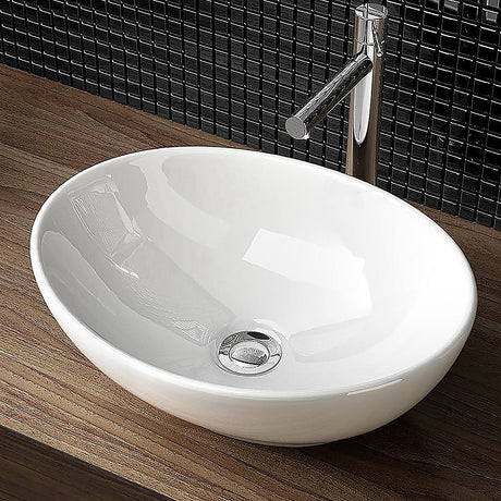 White oval ceramic above counter basin, angled view