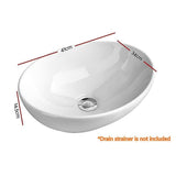 White oval ceramic above counter basin styled on vanity