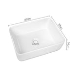 White square ceramic above counter basin, drain hole detail