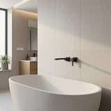 Matte black wall swivel bath spout, close up finish