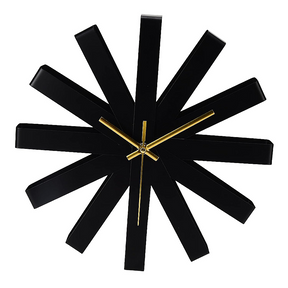 Vivienne stainless steel ribbon wall clock on a modern living room wall