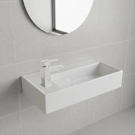 White ceramic compact hand wash basin, angled view