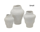 Set of four white ceramic vases in a minimalist Nordic shape, 23 cm tall with a rounded body