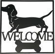 Black metal dachshund welcome wall art 40 cm hanging on a light wall
