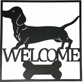 Black metal dachshund welcome wall art 40 cm hanging on a light wall
