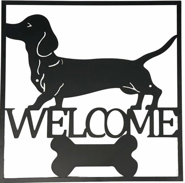 Black metal dachshund welcome wall art 40 cm hanging on a light wall