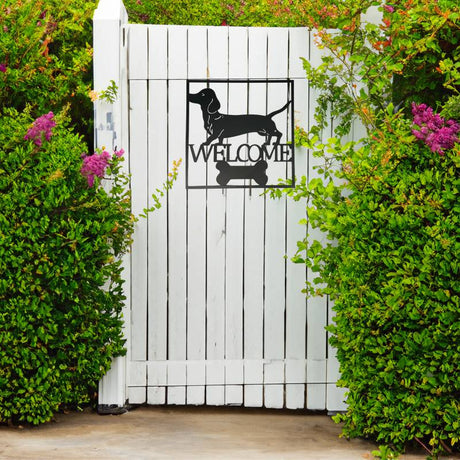 Dachshund welcome metal wall decor styled in an entryway