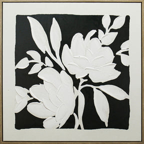 Bold monochrome black and white blooms on a square painted panel in a natural wood frame, companion piece