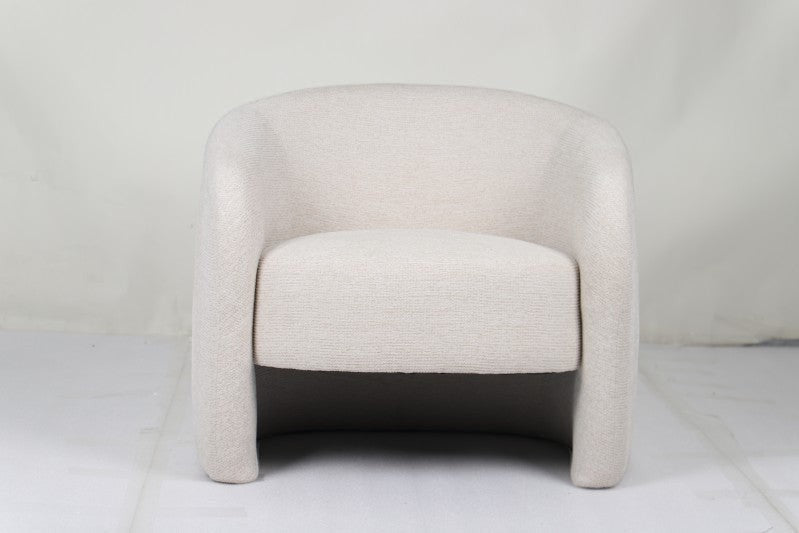 Govetts beige and brown fabric occasional chair in a modern living room