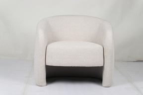 Govetts beige and brown fabric occasional chair in a modern living room