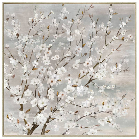 Wood framed blossom canvas print styled on a neutral interior wall