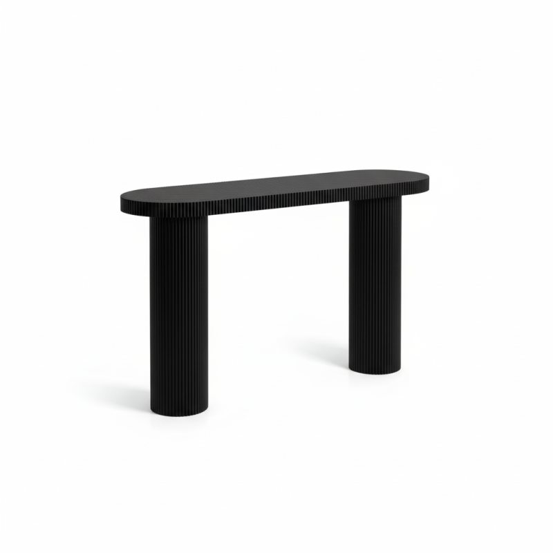 Black console table styled in an entryway with decor