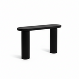 Black console table styled in an entryway with decor