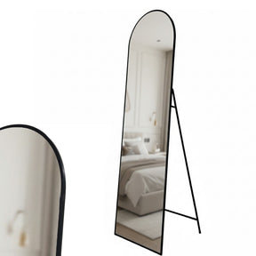 Lorne black metal framed cheval floor mirror in a modern dressing room