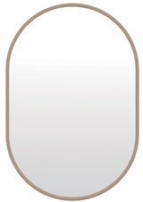 Torquay travertine look oval wall mirror in a modern bedroom