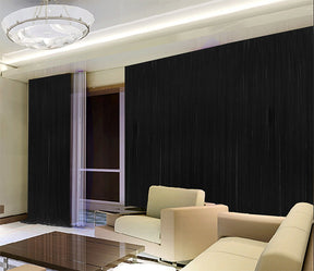 Burradoo black stretch velvet blockout pinch pleat curtains at a grand floor to ceiling window