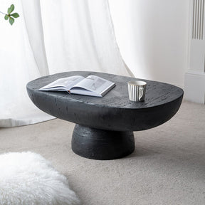 Panton Hill black cement coffee table in a modern living room