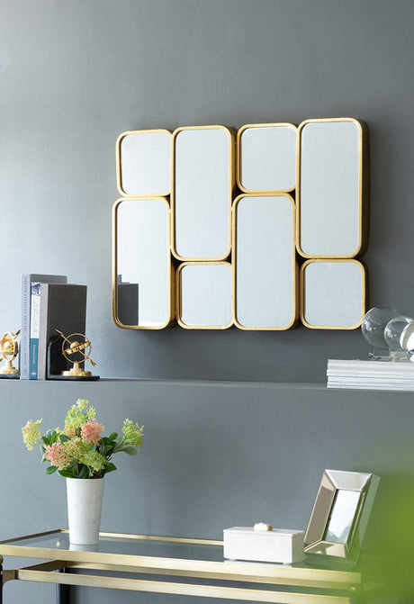 Eastern View gold iron sunburst wall mirror in an entryway