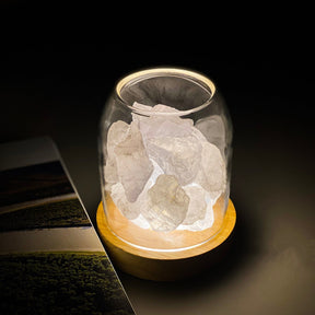 Murs clear quartz crystal aroma diffuser with ambient LED glow on a bedside table