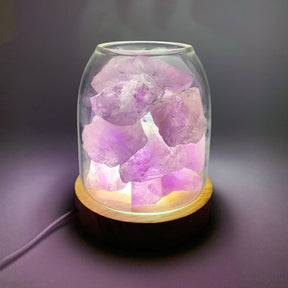 Vaugines amethyst crystal aroma diffuser with soft purple LED glow in a relaxing room