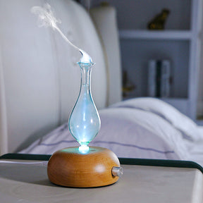 Buoux waterless nebuliser essential oil diffuser with glass chamber on a shelf