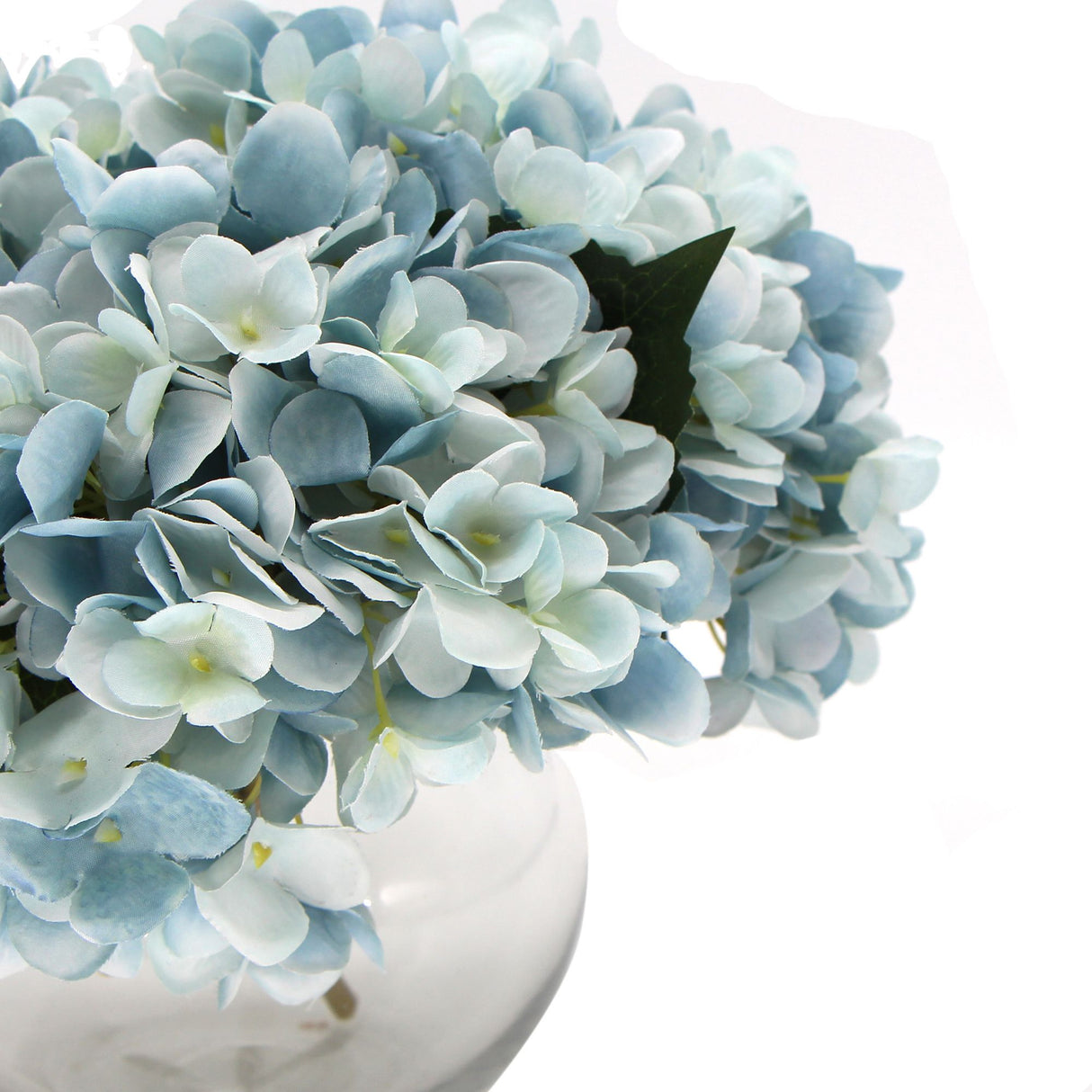 Artificial hydrangea in glass vase styled on dining table — Allure Home Collections