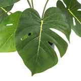 Artificial split philodendron plant styled on desk — Allure Home Collections