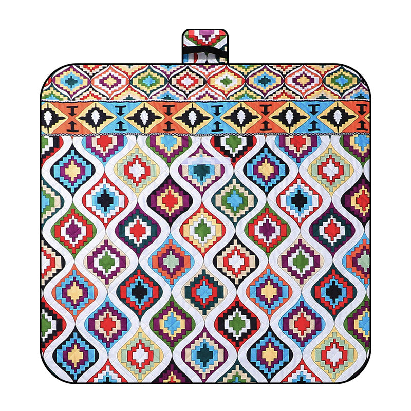 Staveley Morocco pattern picnic blanket 150 x 200cm laid on grass with thickened patterned top and water resistant backing