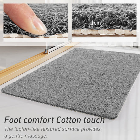 Side view of grey loofah bath mat showing 1 cm foam thickness and backing