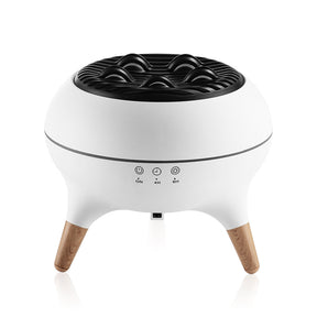Saignon jellyfish aroma diffuser with ambient lighting and rising mist on a desk