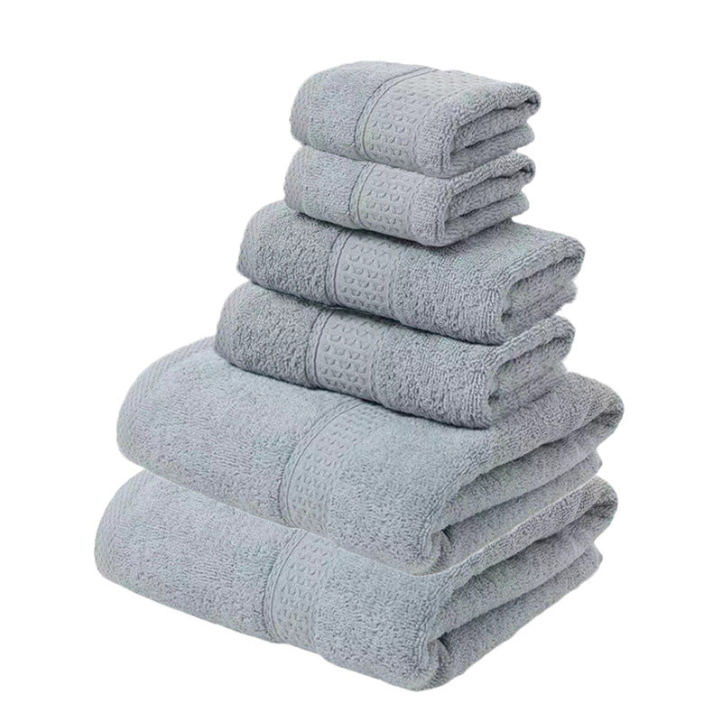Grey 100% cotton six piece towel set with bath towels, hand towels and face washers folded in a stack