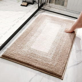 Carvoeiro grey gradient striped non slip bathroom rug at a shower entrance